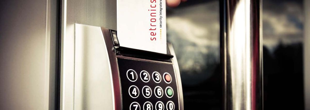 A Setronics access control keypad mounted beside a door